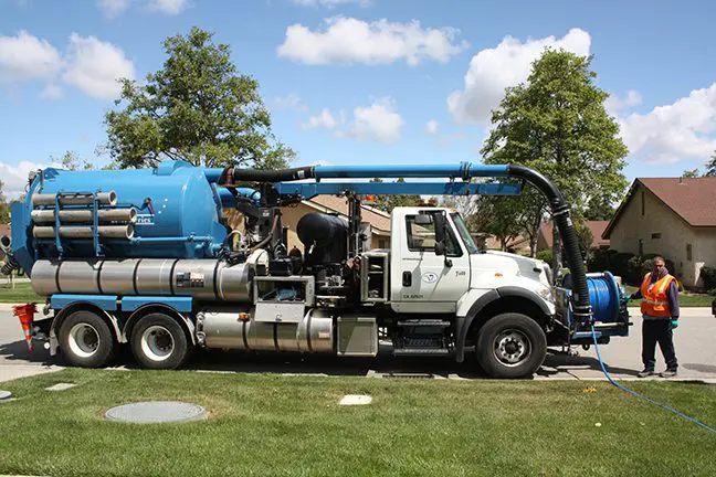 Vactor vacuum truck and operator at work